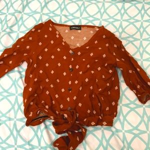 brown blouse with a tie